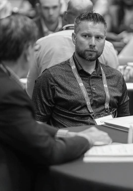 Portrait of a conference attendee at NextGen Attend Ascend, engaging in professional networking and learning opportunities.