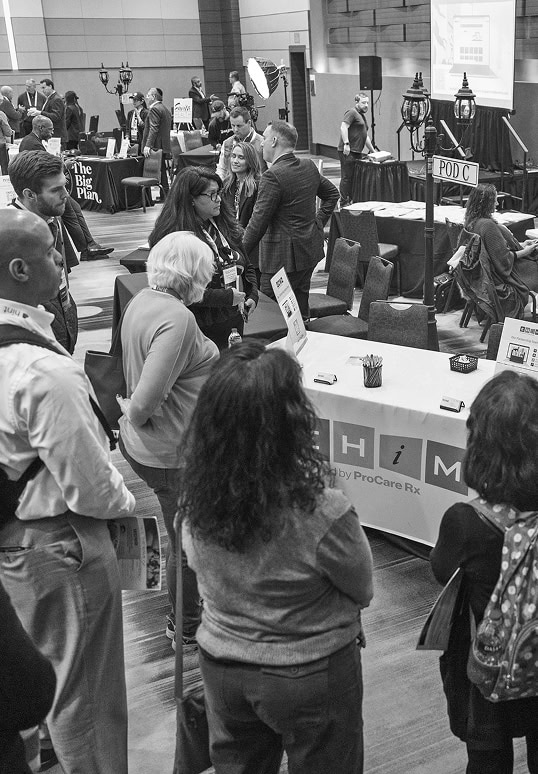 Vibrant healthcare conference networking scene at NextGen Attend Ascend event, showcasing industry professionals engaging at exhibitor booths, fostering collaboration, and exploring innovative health solutions.